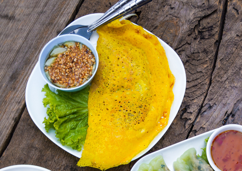 How to Eat Banh Xeo the Right Way (And Why the Herbs Matter So Much)